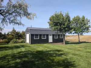 Portable building with lofted roof and garage door, Waycross Georgia install