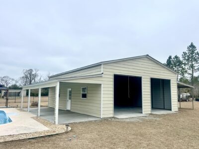 Enclosed metal structure with dual bay doors for equipment storage